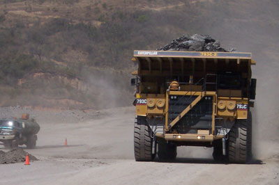mine haul truck on a road treated for soil stabilization
