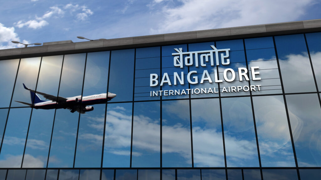 Plane reflected on the windows of the Bangalore International Airport in India.